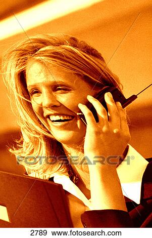 Stock Photo - Woman on cell phone. Fotosearch