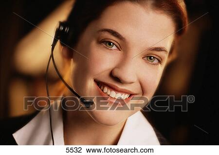 Woman wearing telephone headset View Large Photo Image Stock Image - Woman wearing telephone headset. Fotosearch