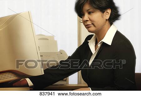 Woman working on computer View Large Photo Image Stock Image - Woman working on computer. Fotosearch