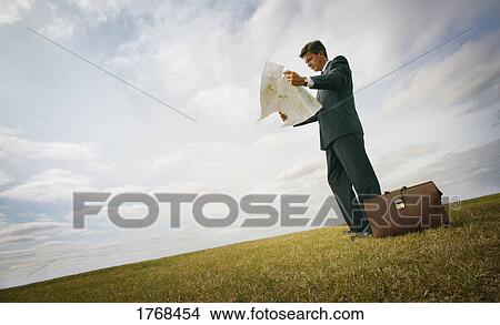 Businessman in field View Large Photo Image Picture - Businessman in field. Fotosearch
