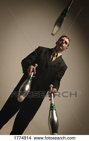 Businessman juggling View Large Photo Image Picture - Businessman juggling. Fotosearch
