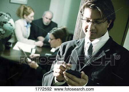 Stock Image - Businessman outside meeting. Fotosearch