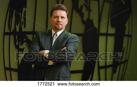 Businessman with world in the background View Large Photo Image Stock Image - Businessman with world in the background. Fotosearch