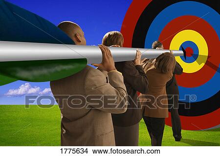 Businesspeople with arrow aiming at target View Large Photo Image Picture - Businesspeople with arrow aiming at target. Fotosearch