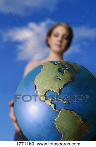 Caucasian woman holding globe View Large Photo Image Stock Image - Caucasian woman holding globe. Fotosearch