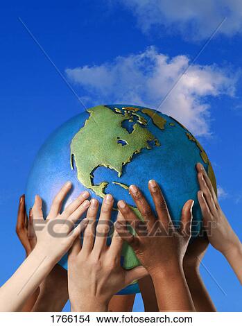 Paveikslėlis - Hands on a globe. Fotosearch