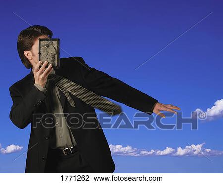 Man in suit covering face with pin board View Large Photo Image Stock Image - Man in suit covering face with pin board. Fotosearch