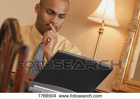 Man on a laptop View Large Photo Image Picture - Man on a laptop. Fotosearch