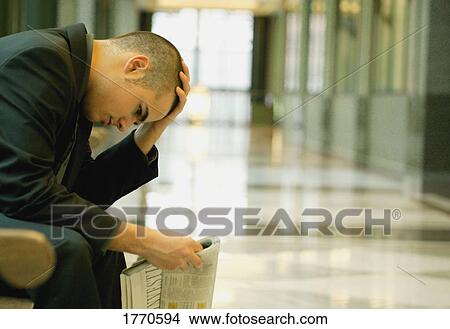 Man studying newspaper View Large Photo Image Picture - Man studying newspaper. Fotosearch