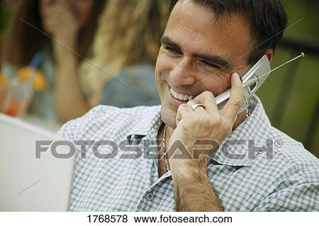 Man with cell phone View Large Photo Image Stock Photo - Man with cell phone. Fotosearch