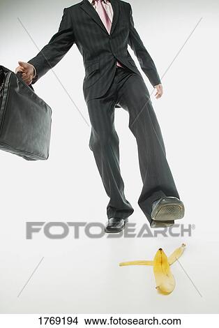 Slipping on a banana peel View Large Photo Image Picture - Slipping on a banana peel. Fotosearch