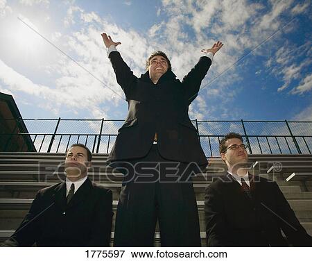 Triumphant businessman View Large Photo Image Stock Photo - Triumphant businessman. Fotosearch