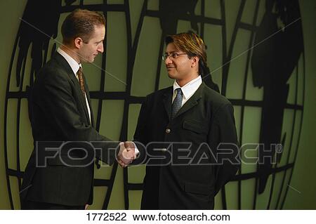 Two businessmen shaking hands View Large Photo Image Stock Image - Two businessmen shaking hands. Fotosearch