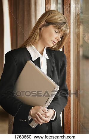 Stock Image - Woman with laptop computer. Fotosearch