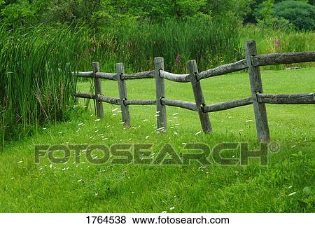 Stock Photo - A wooden fence. Fotosearch
