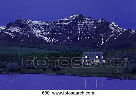 Cabin beside lake and mountain View Large Photo Image Stock Image - Cabin beside lake and mountain. Fotosearch