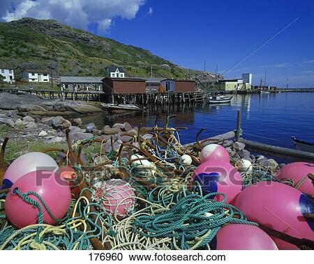 Rocky shoreline and small fishing community View Large Photo Image Stock Image - Rocky shoreline and small fishing community. Fotosearch