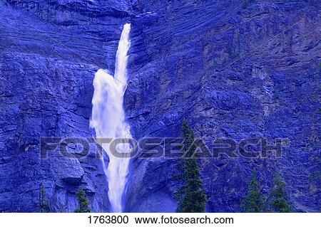 Stock Image - Waterfall in the mountains Takakkaw Falls British Columbia Yoho National Park. Fotosearch