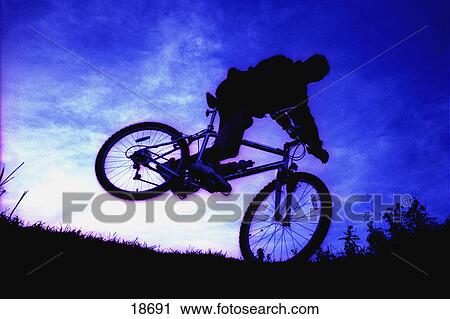 Stock Image - A bicycle stunt. Fotosearch