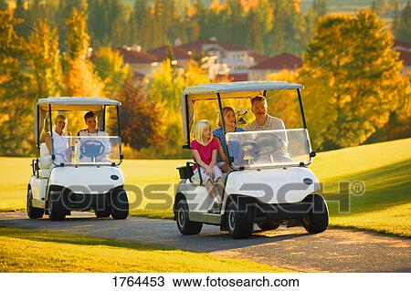 A family driving golf carts View Large Photo Image Stock Image - A family driving golf carts. Fotosearch