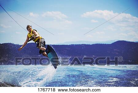 A wake boarder jumps View Large Photo Image Stock Photo - A wake boarder jumps. Fotosearch