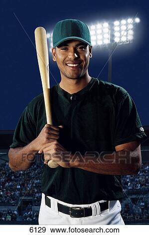 Stock Photo - Baseball player with bat on shoulder. Fotosearch