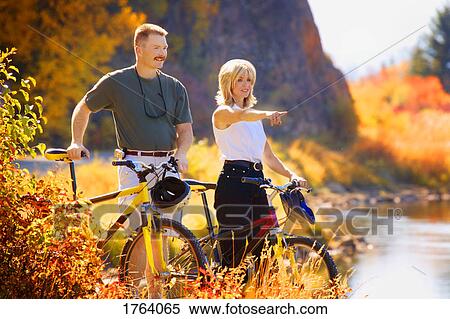 Couple stop to admire view View Large Photo Image Stock Photography - Couple stop to admire view. Fotosearch
