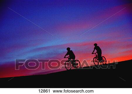 Cyclists at sunset View Large Photo Image Stock Image - Cyclists at sunset. Fotosearch