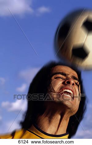 Man heading soccer ball View Large Photo Image Picture - Man heading soccer ball. Fotosearch