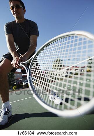 Picture - Man plays tennis. Fotosearch