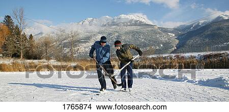Playing one on one View Large Photo Image Picture - Playing one on one. Fotosearch