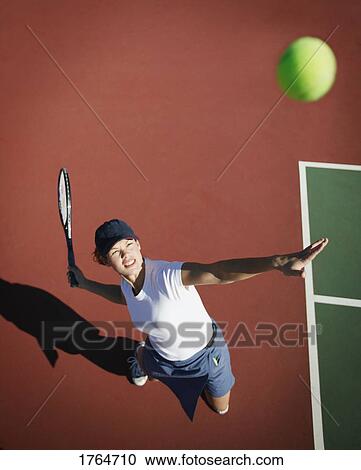 Woman playing tennis View Large Photo Image Stock Image - Woman playing tennis. Fotosearch