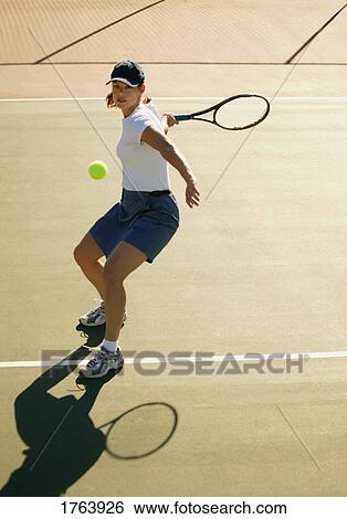 Woman playing tennis View Large Photo Image Stock Photograph - Woman playing tennis. Fotosearch