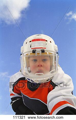 Young boy in hockey gear View Large Photo Image Stock Image - Young boy in hockey gear. Fotosearch