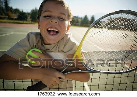 Boy with tennis racket View Large Photo Image Stock Image - Boy with tennis racket. Fotosearch