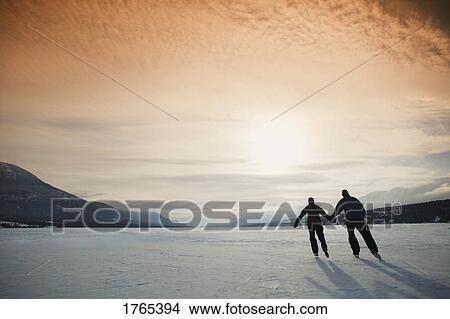 Couple goes skating View Large Photo Image Picture - Couple goes skating. Fotosearch