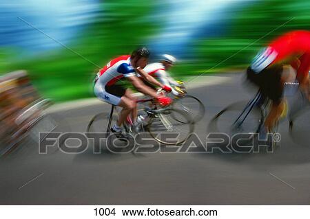 Cyclists racing on road View Large Photo Image Picture - Cyclists racing on road. Fotosearch