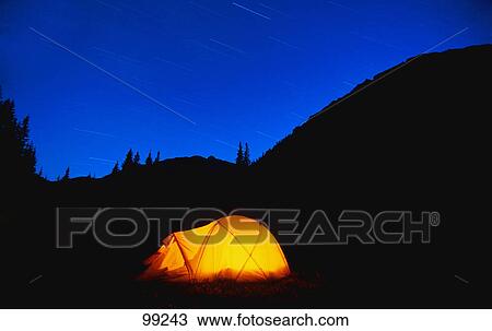 Glowing tent with star trails in the mountains View Large Photo Image Stock Image - Glowing tent with star trails in the mountains. Fotosearch