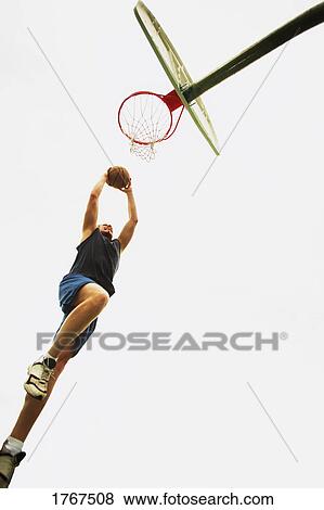 Man playing basketball View Large Photo Image Stock Photo - Man playing basketball. Fotosearch