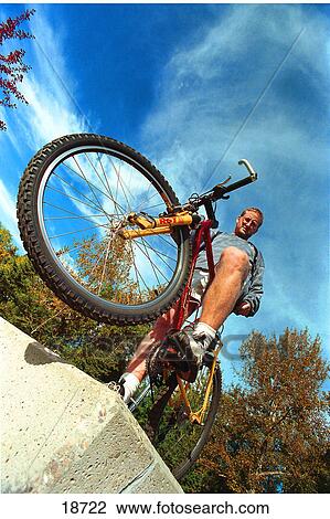 Stock Image - Man with mountain bike. Fotosearch