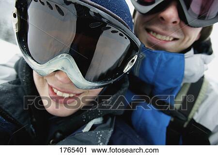 Stock Image - Portrait of a couple with goggles. Fotosearch