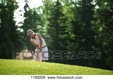 Stock Photo - Shot out of the sand. Fotosearch