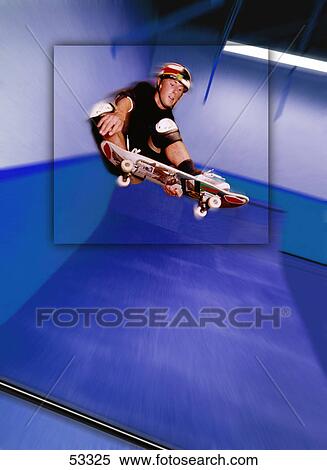 Stock Photography - Skateboarder at top of jump. Fotosearch
