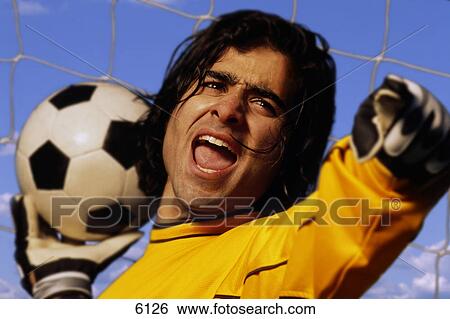 Soccer goalkeeper throwing ball View Large Photo Image Stock Photograph - Soccer goalkeeper throwing ball. Fotosearch