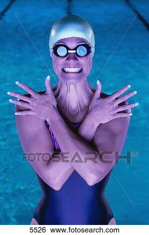Swimmer with goggles in front of pool View Large Photo Image Stock Photograph - Swimmer with goggles in front of pool. Fotosearch