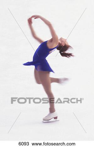 Stock Image - Woman figure skating. Fotosearch