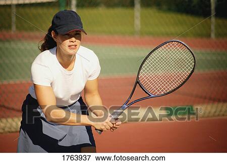 Woman playing tennis View Large Photo Image Stock Photo - Woman playing tennis. Fotosearch