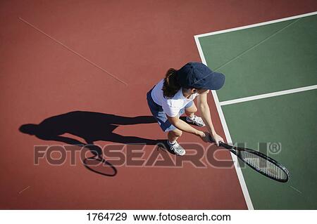Woman plays tennis View Large Photo Image Stock Photo - Woman plays tennis. Fotosearch
