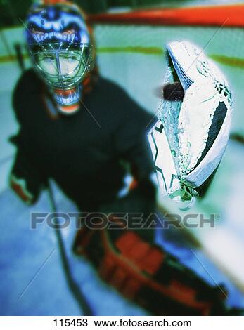 Young goalie in net with glove extended View Large Photo Image Stock Image - Young goalie in net with glove extended. Fotosearch