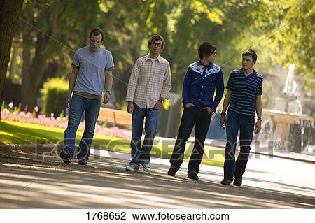 A group of guys walking View Large Photo Image Stock Image - A group of guys walking. Fotosearch